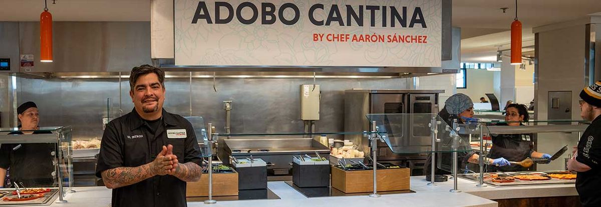 Chef Aaron Sanchez stands in front of the counter at Adobo Cantina.